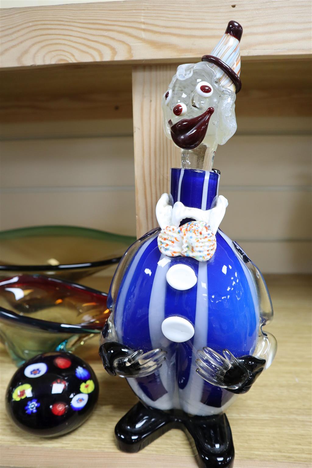 Five items of Art glass, including a clown flask and stopper,